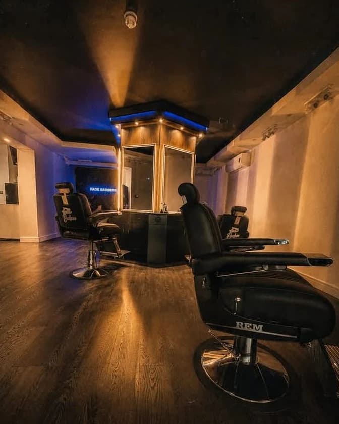 Inside Fade Barbers - REM chairs, the mirror column and the neon sign