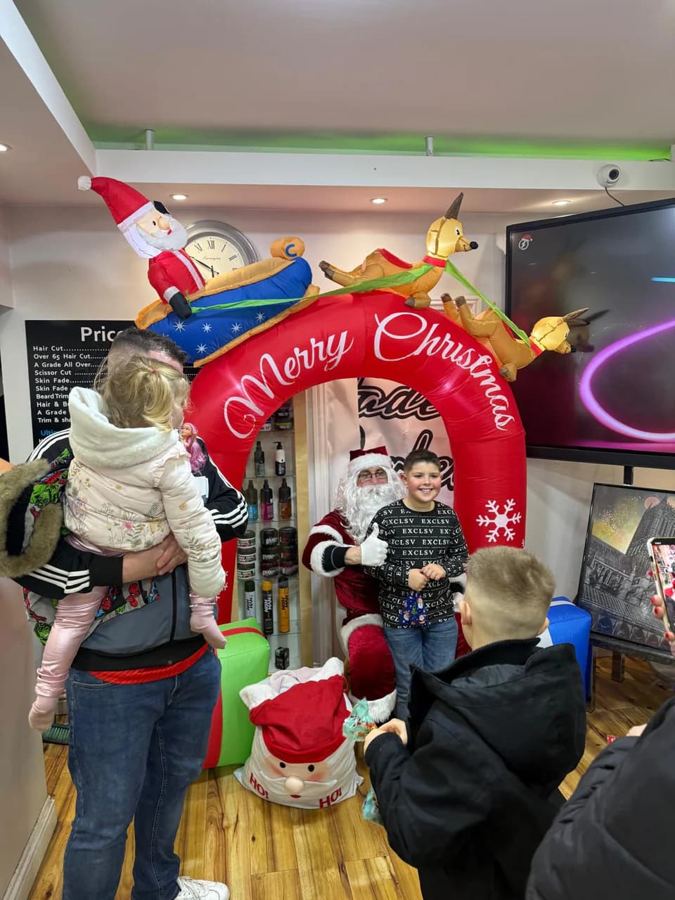 Families waiting their turn at the Christmas arch inside the shop